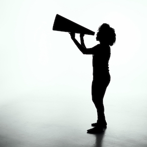 Person shouting into a megaphone
